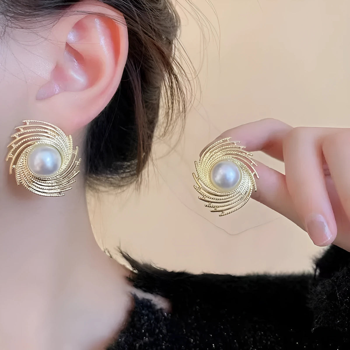 A pair of women's vintage-style alloy earrings with an irregular floral shape and a pearl electroplated colour.