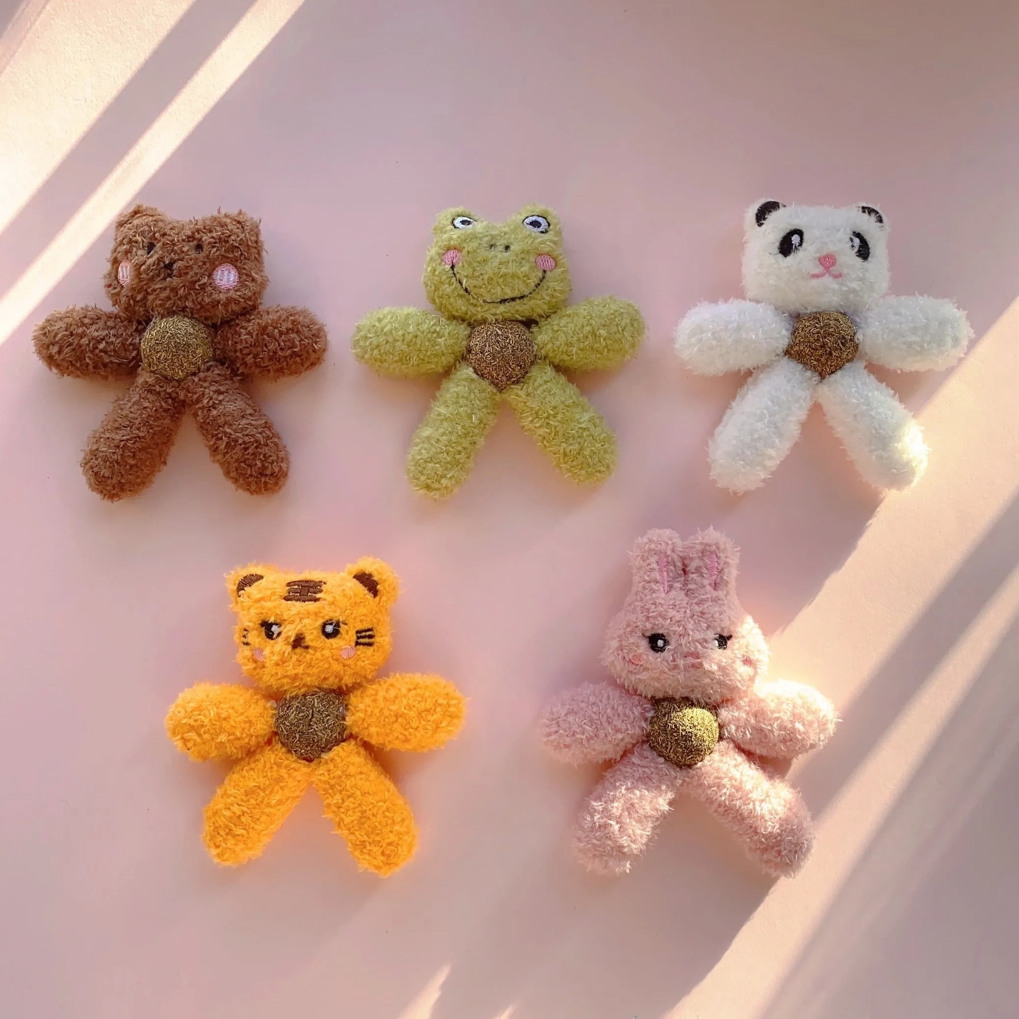 Plush catnip ball chewing toy in animal designs for dental care, showing scale next to a 12.5 cm ruler.