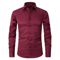 Man wearing a stretch long sleeve polyester work shirt in a solid colour.