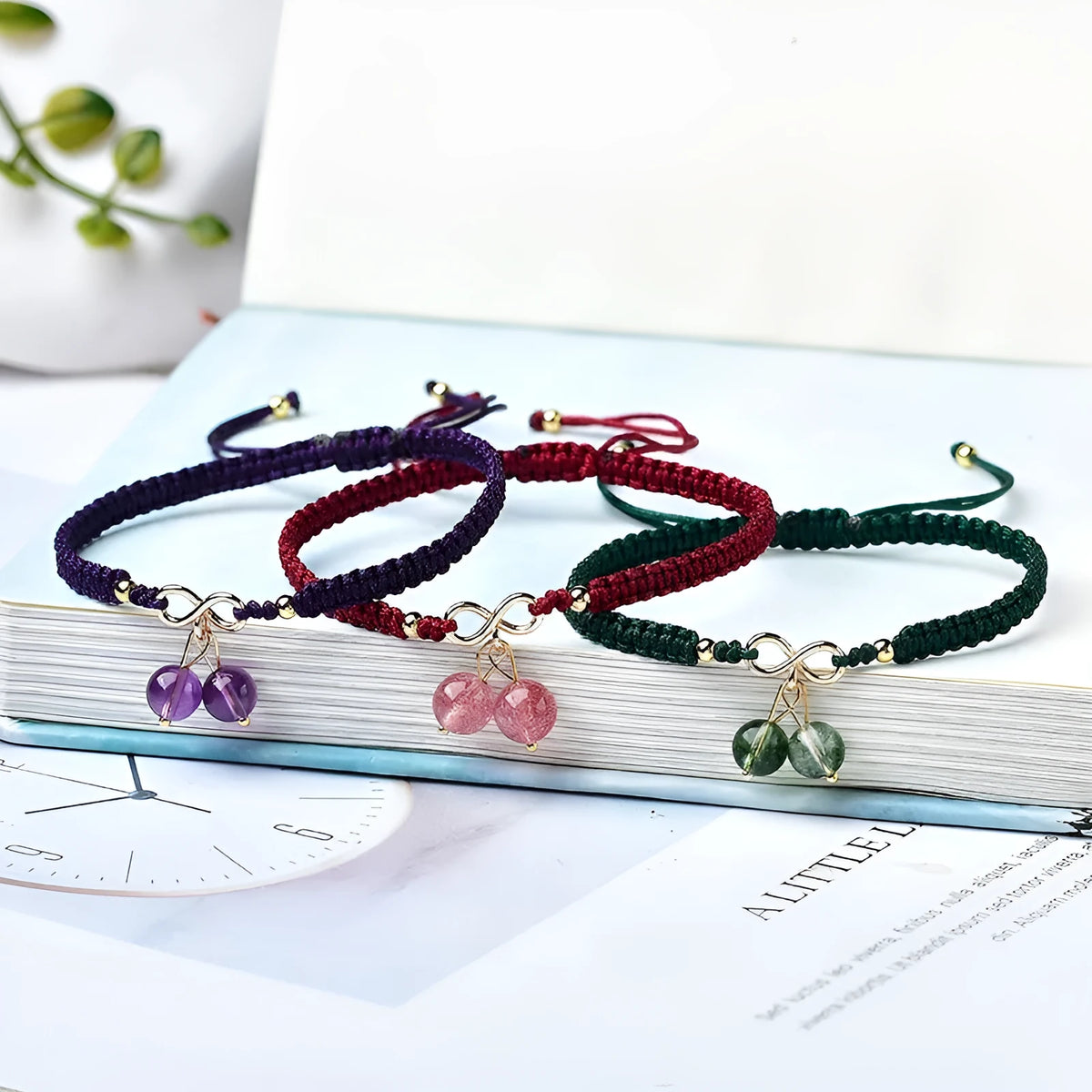 Women's natural crystal bracelet with fruit-shaped beads in strawberry quartz, amethyst, or green phantom quartz.
