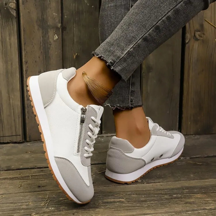 Women's flat-heeled shoes in champagne colour with artificial PU upper and rubber sole.
