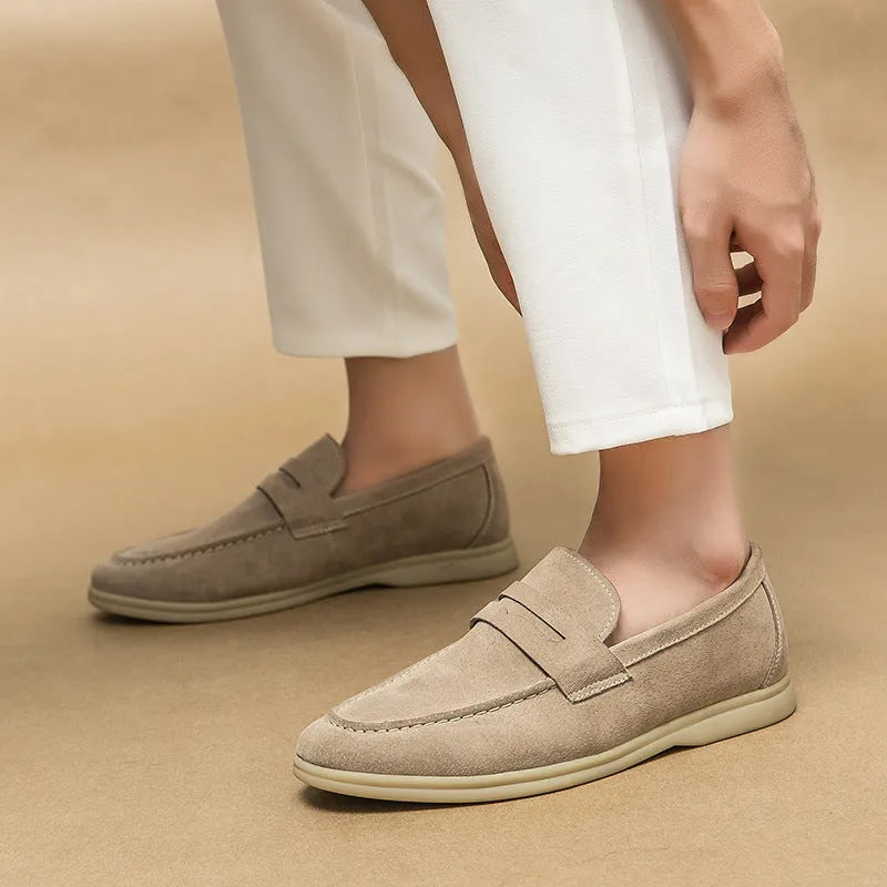 Men's black leather slip-on shoes with round toe and rubber sole on a white background