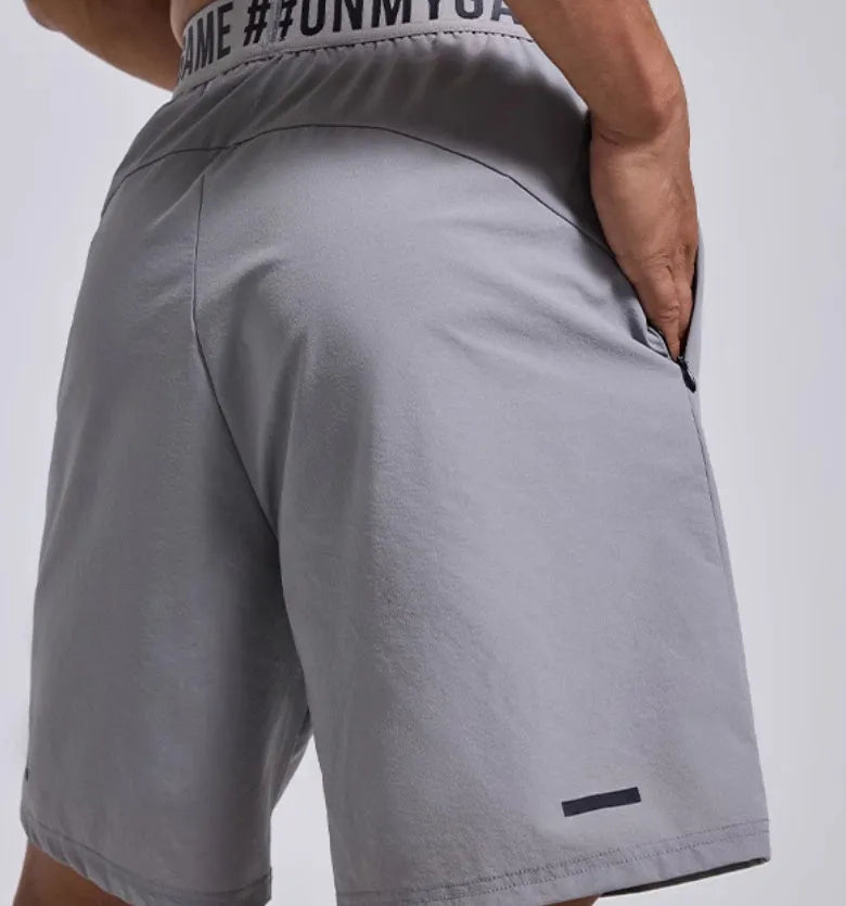 Men's black elastic waist sports shorts with cropped length for workouts