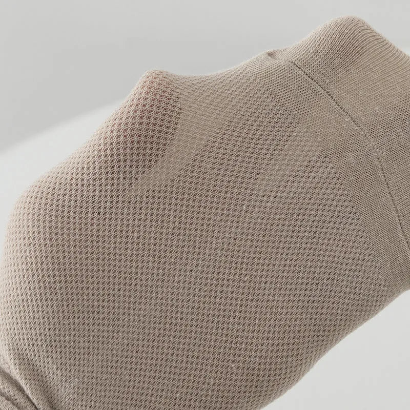 Solid colour low-cut polyester boat socks for men on a white background.