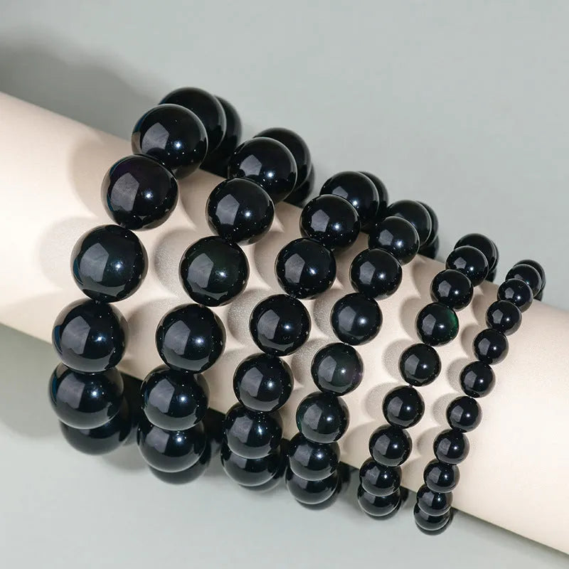 Hand-woven obsidian crystal bracelet couple set showing six colour variations with round beads