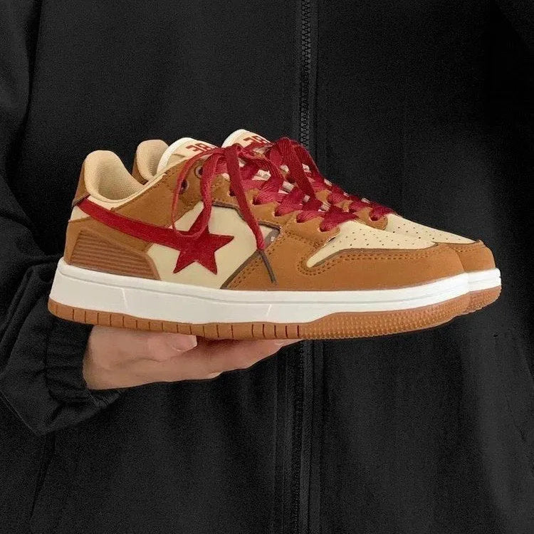 Brown women's low-top platform sneakers with sequin trim and round toe, shown from the side.