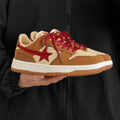Brown women's low-top platform sneakers with sequin trim and round toe, shown from the side.