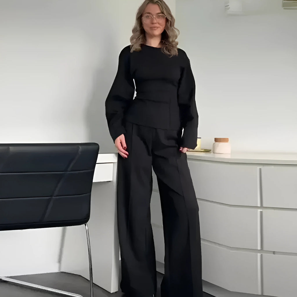 Women's polar fleece suit set showing long sleeve pleated top with wide leg trousers in coordinating colours