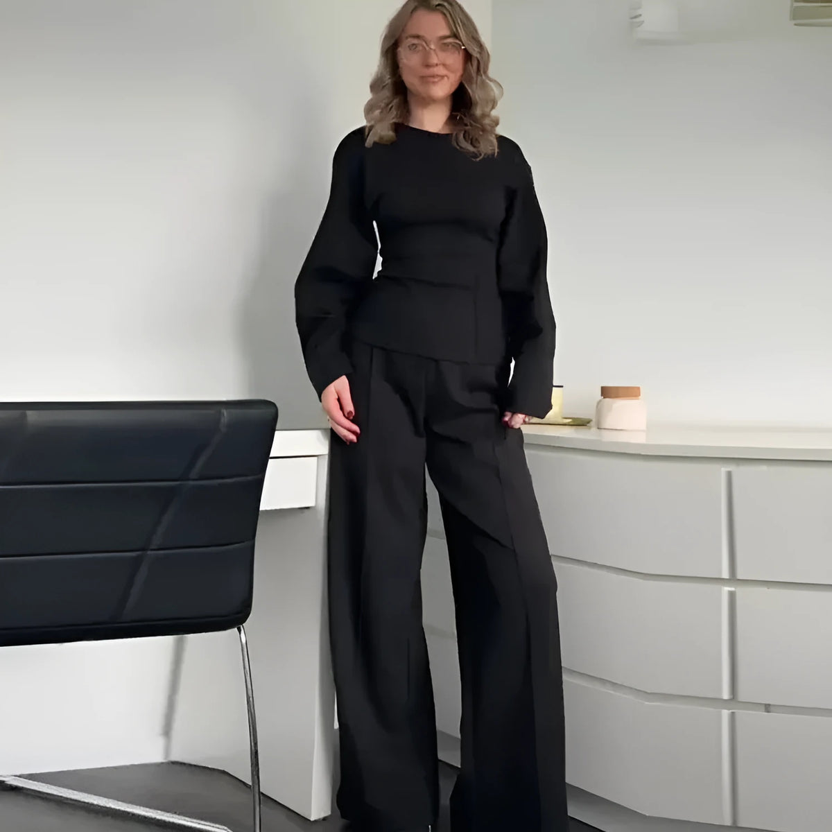 Women's polar fleece suit set showing long sleeve pleated top with wide leg trousers in coordinating colours