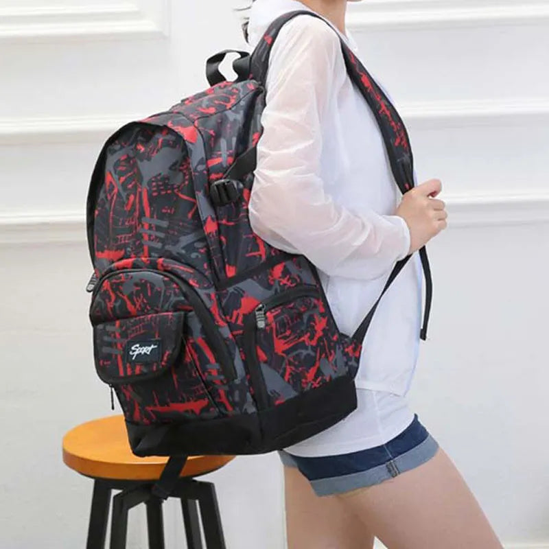 Blue nylon backpack with adjustable straps and large main compartment.