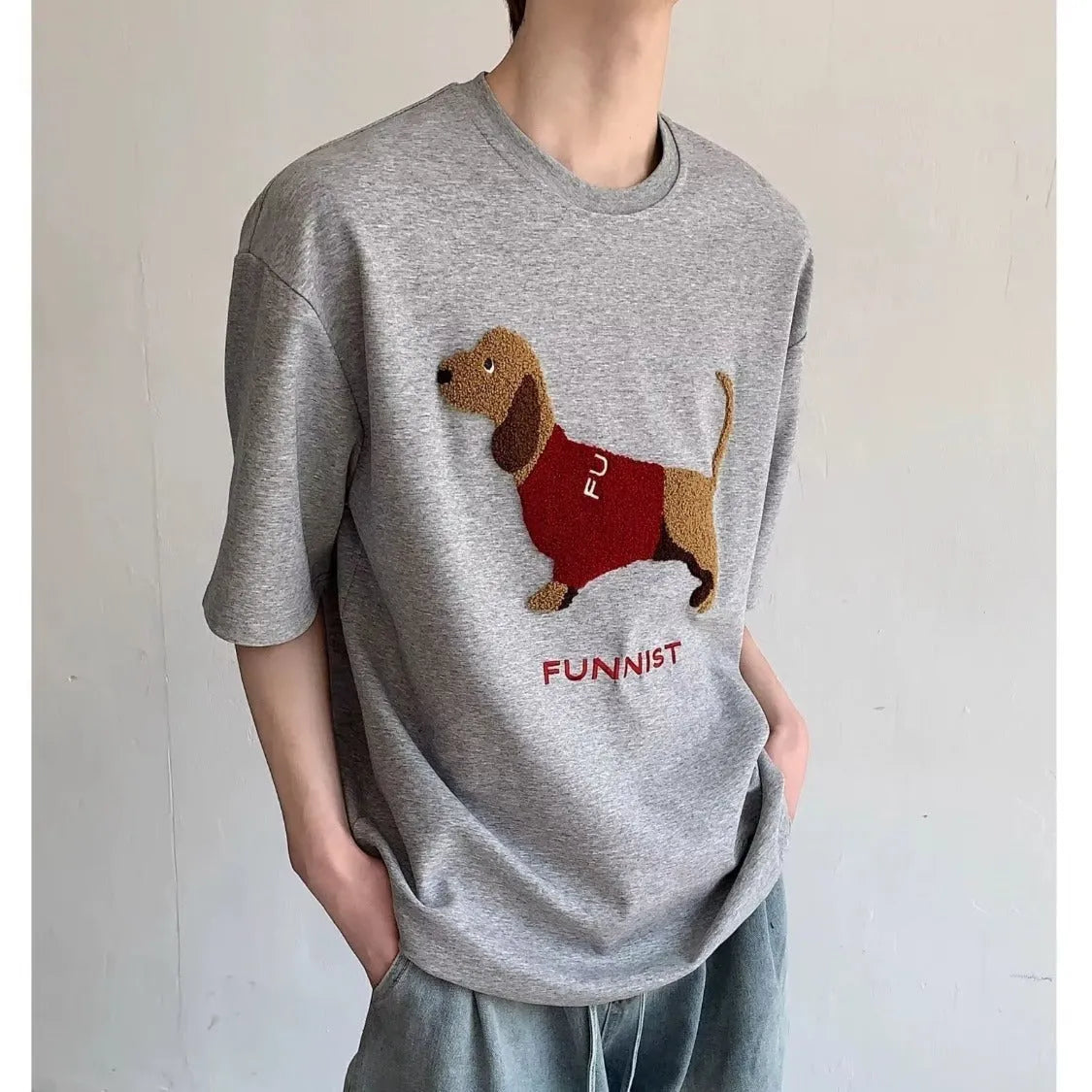 Mens grey cotton T-shirt with embroidered sausage dog towel design on front.