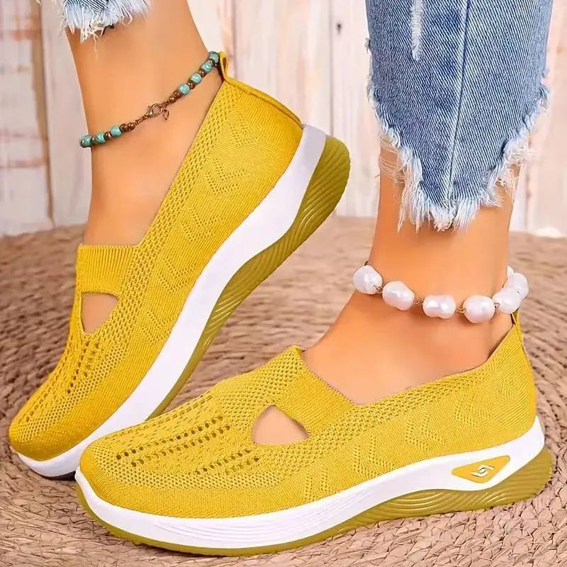 Pair of low top casual mesh shoes with T-strap and soft PVC sole in solid colour for elderly women