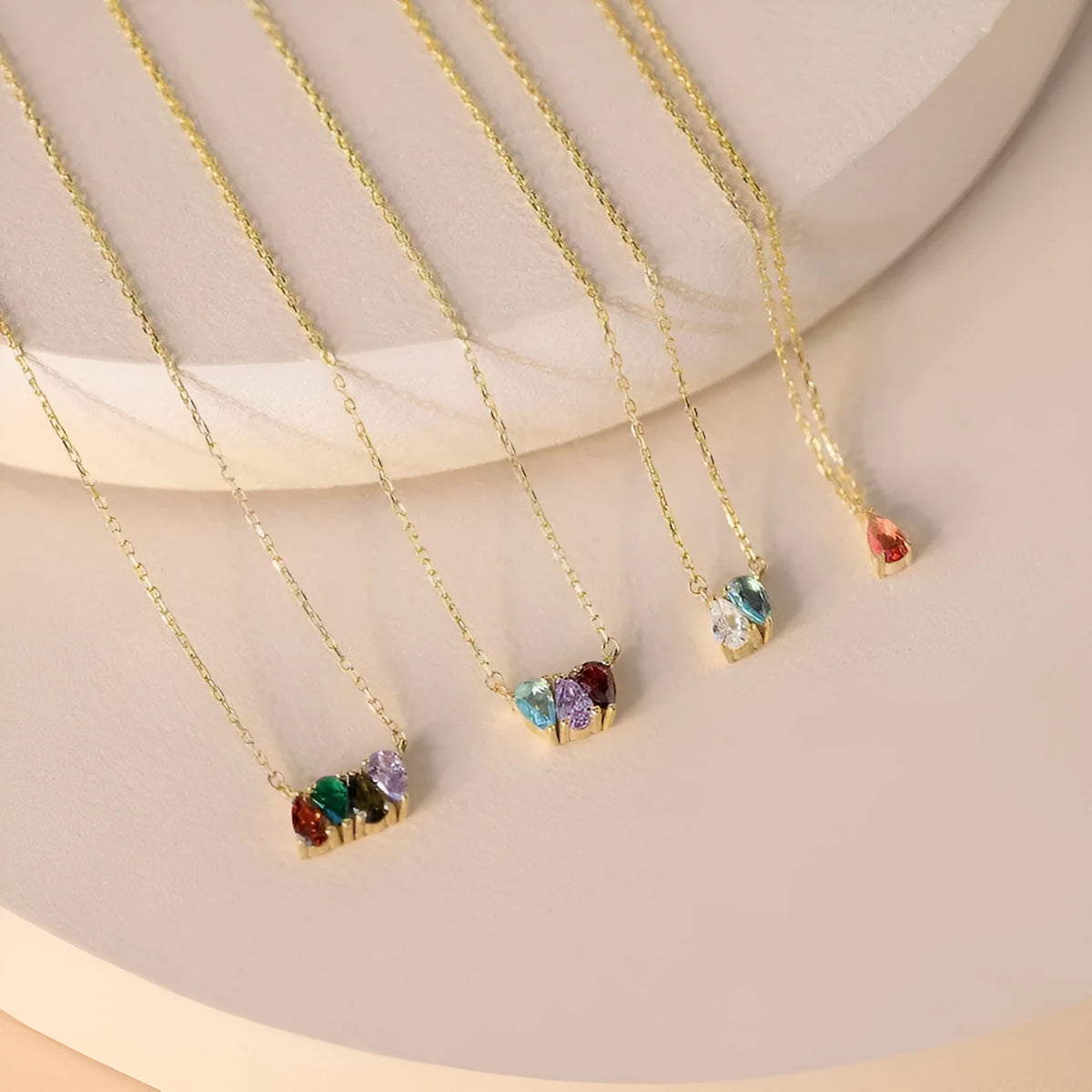 Titanium steel birthstone necklace with a single zircon pendant on a princess-length chain.