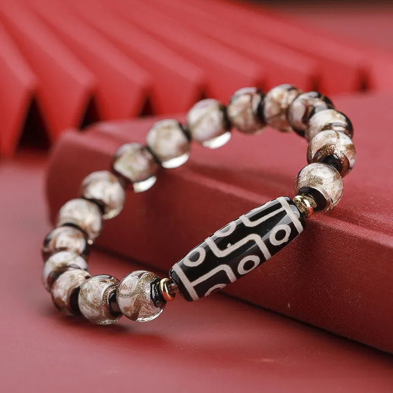 Chinese style lucky bracelet with colourful coloured glaze beads and auspicious patterns.
