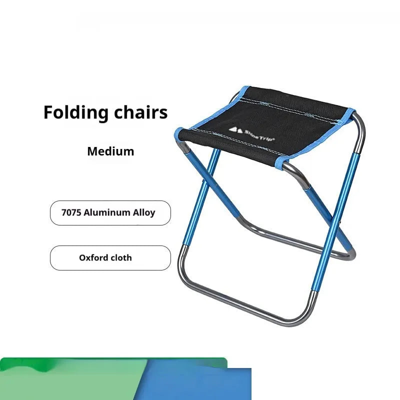 Black aluminium alloy folding stool shown in folded and unfolded positions for camping and outdoor use.