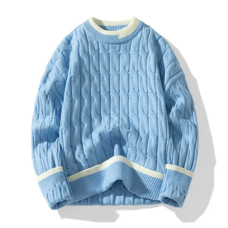 Man wearing a loose-fit, light blue, long sleeve two-piece acrylic sweater set