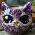 Pastel coloured geode resin mug with crystal texture and cat motif, shown in purple.