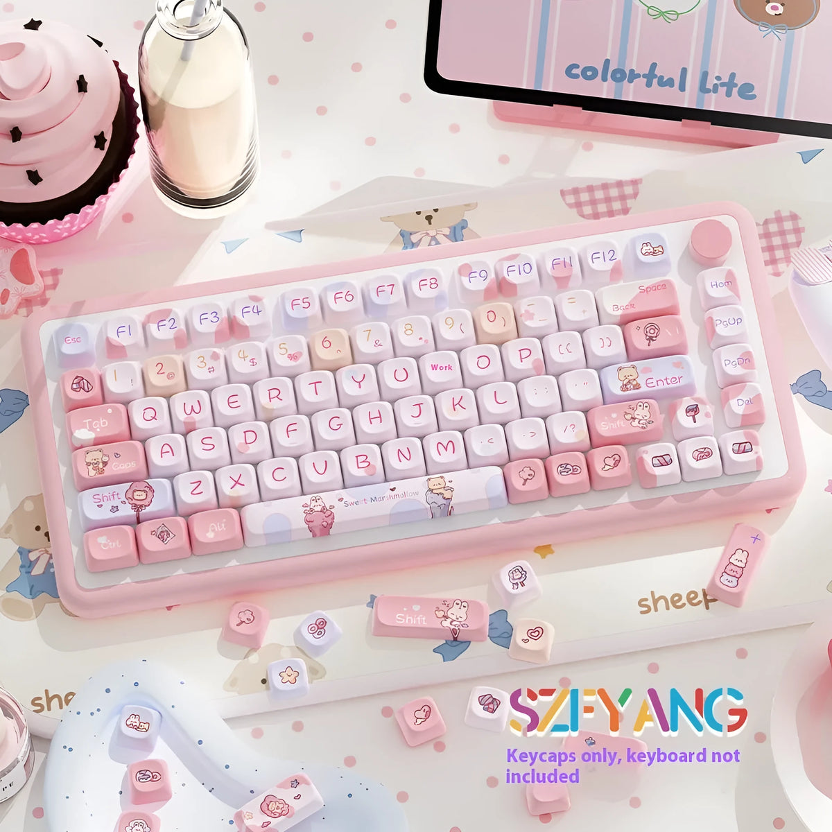 Sweet cotton candy coloured PBT pudding keycaps for mechanical keyboards on a desk