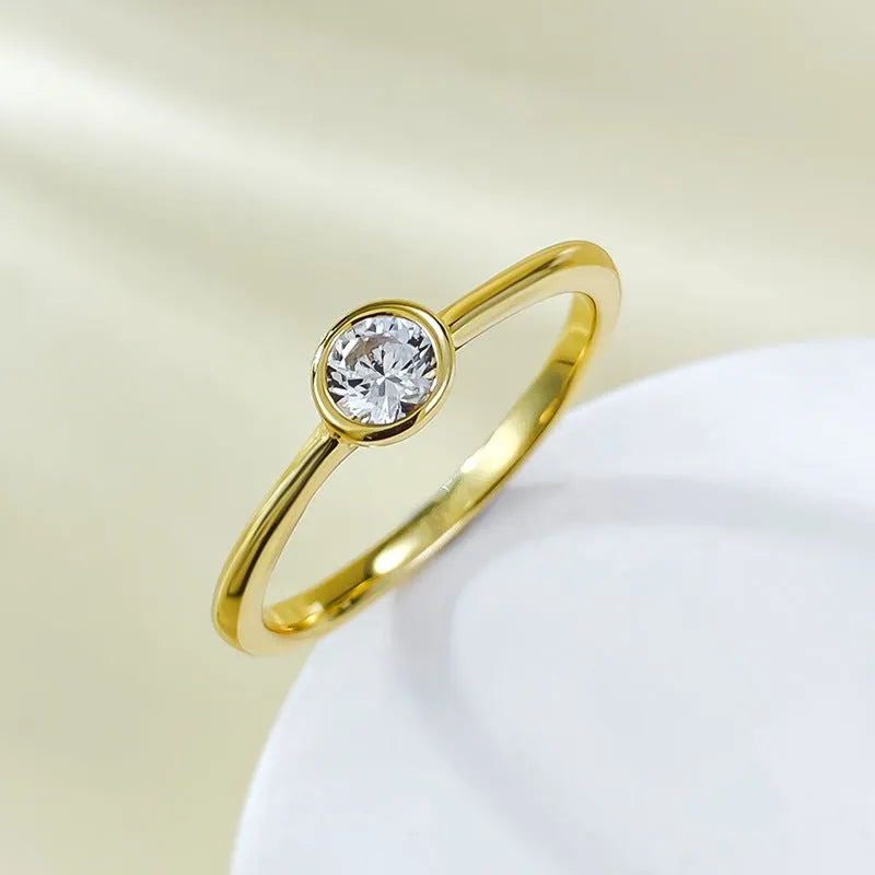 Minimalist silver crown-shaped ring with linear engraving detail in gold or platinum electroplated finish.