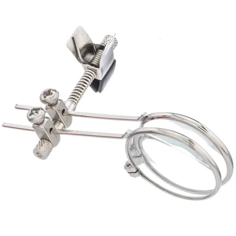 Metal and glass reading glass mirror with double clip for attaching to spectacles.