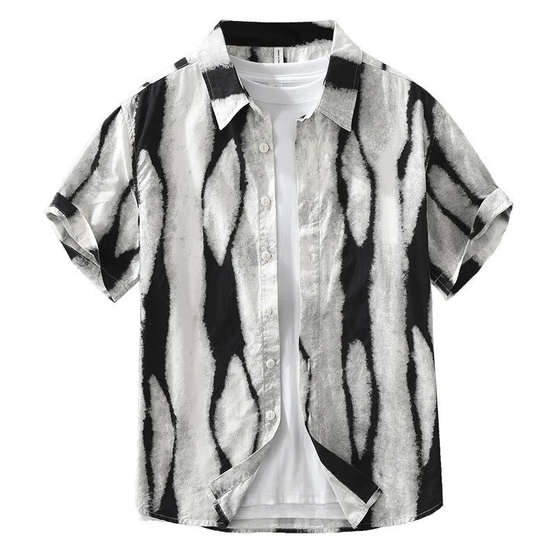 Man wearing a black and white retro striped loose-fit short sleeve cotton shirt.