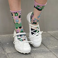 Women's silver sports shoes with lace-up front and decorative bow detail on microfiber upper