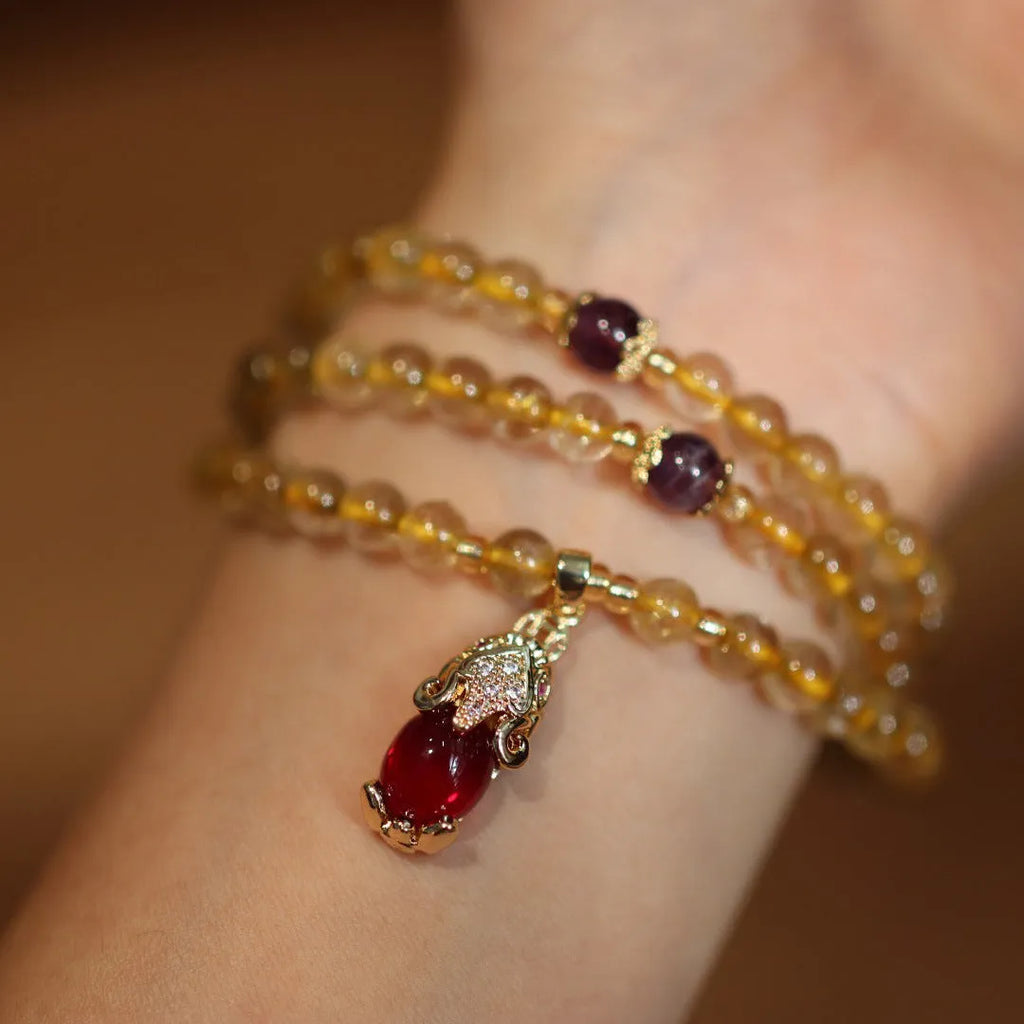Brazilian gold rutilated quartz bracelet with three gold-plated rings, Chinese style design