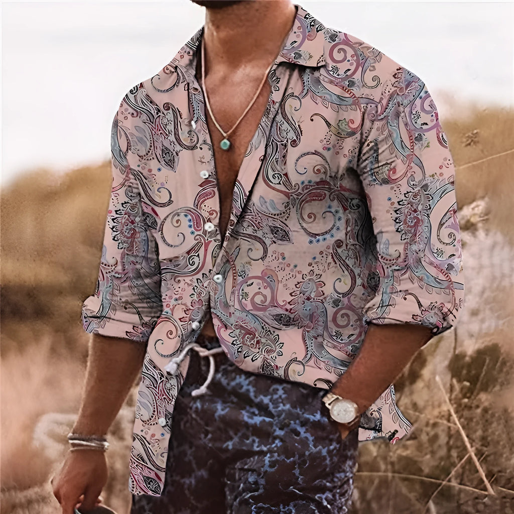 Man wearing a loose-fit bohemian-style shirt with a vibrant 3D floral print and long sleeves.