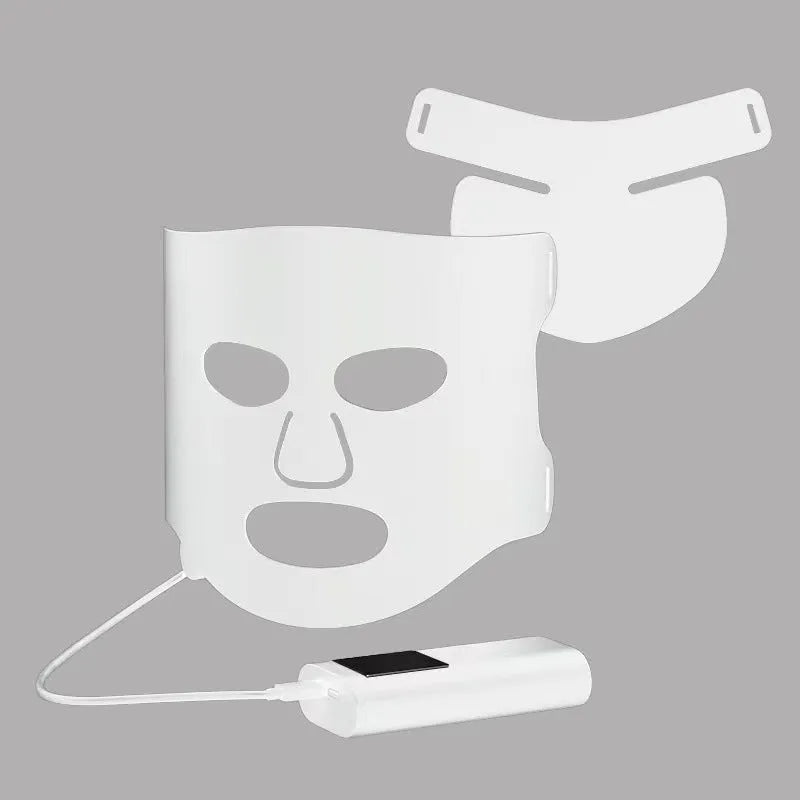 Black and white LED phototherapy face mask with controller showing seven different coloured light modes for skincare.
