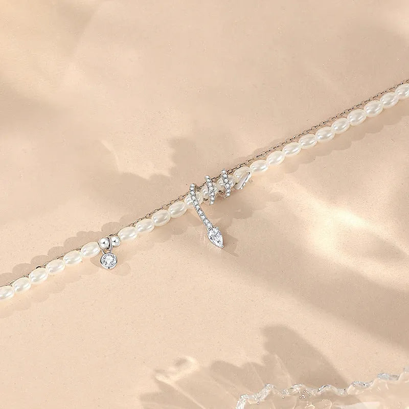 Pearl Snake 925 silver bracelet with snake charm, available in gold or white gold electroplated finish.