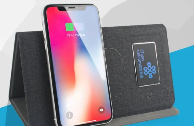 Folding wireless charging mouse pad set showing cloth surface with separate wireless mouse and compact folded size