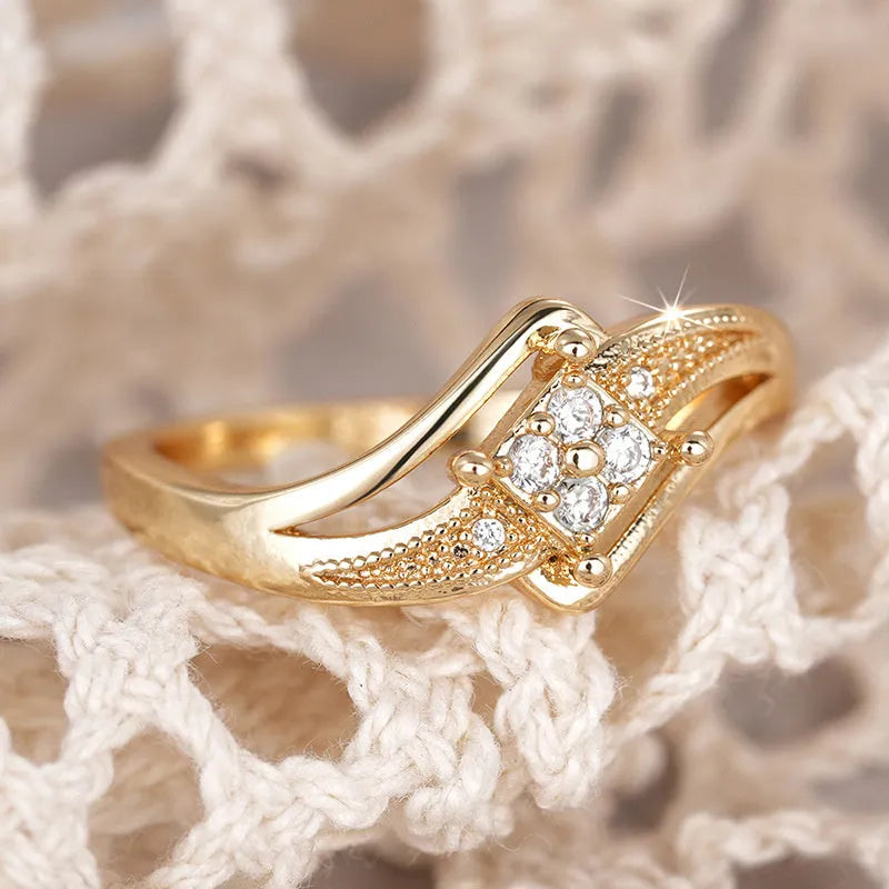 Copper diamond ring with geometric ornament and micro inlaid zircon in yellow gold colour