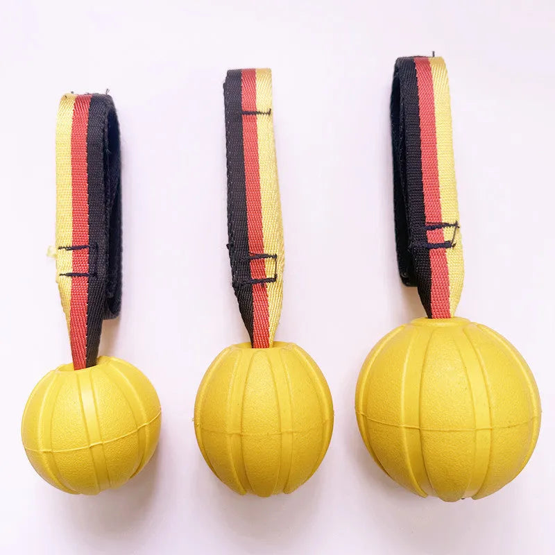 Floating EVA pet training ball with attached string in camouflage or yellow colour