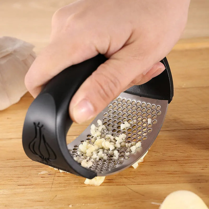 304 stainless steel garlic press in green colour showing modern simplicity design