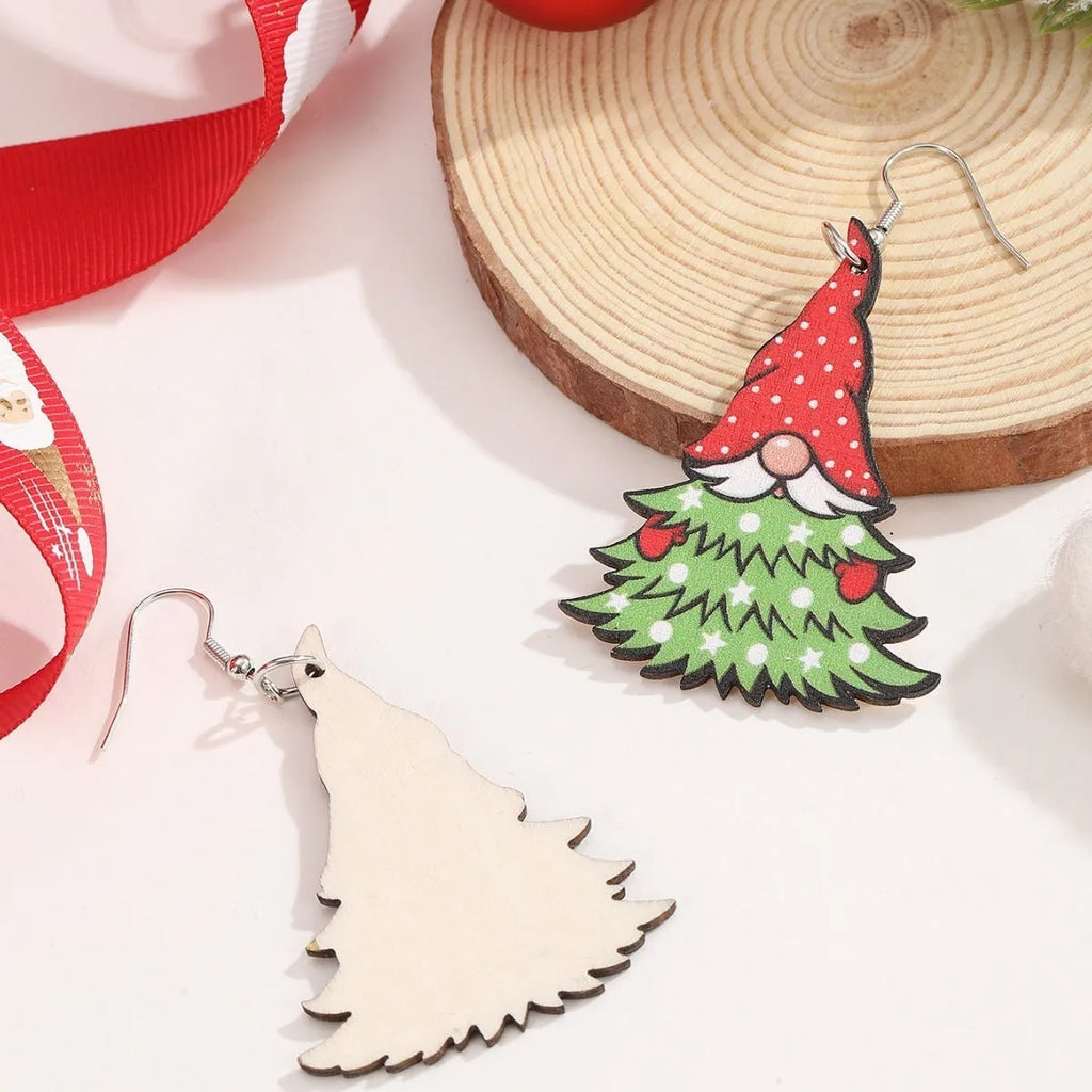 Wooden Christmas earrings with printed geometric designs featuring Santa Claus elements