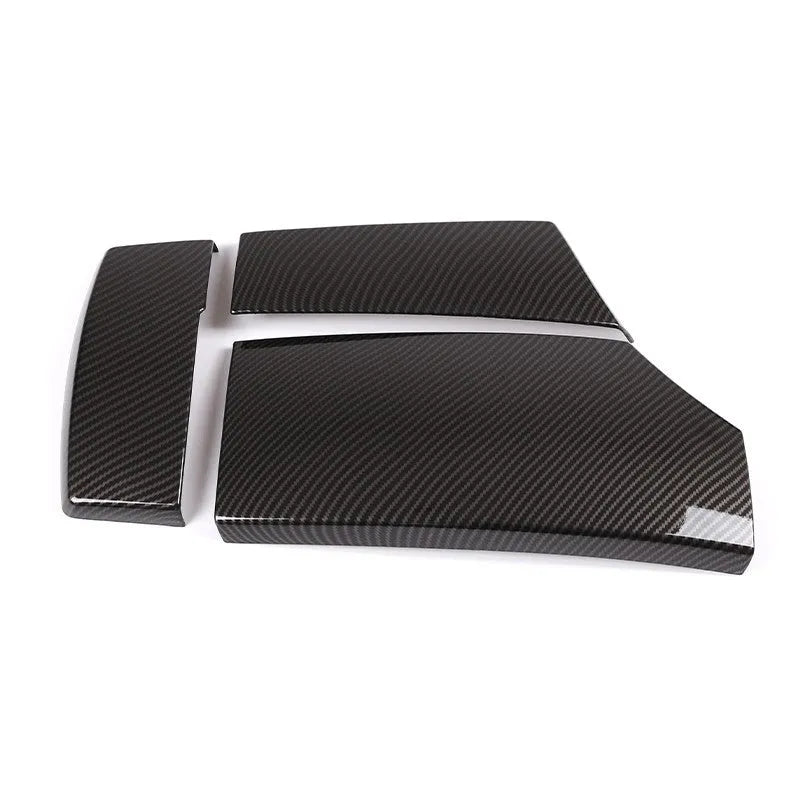 Three black ABS armrest box protective covers with a shiny carbon fibre weave pattern.