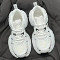 Beige Polar Wave mesh platform sports shoes with a wedge heel and lace-up front.
