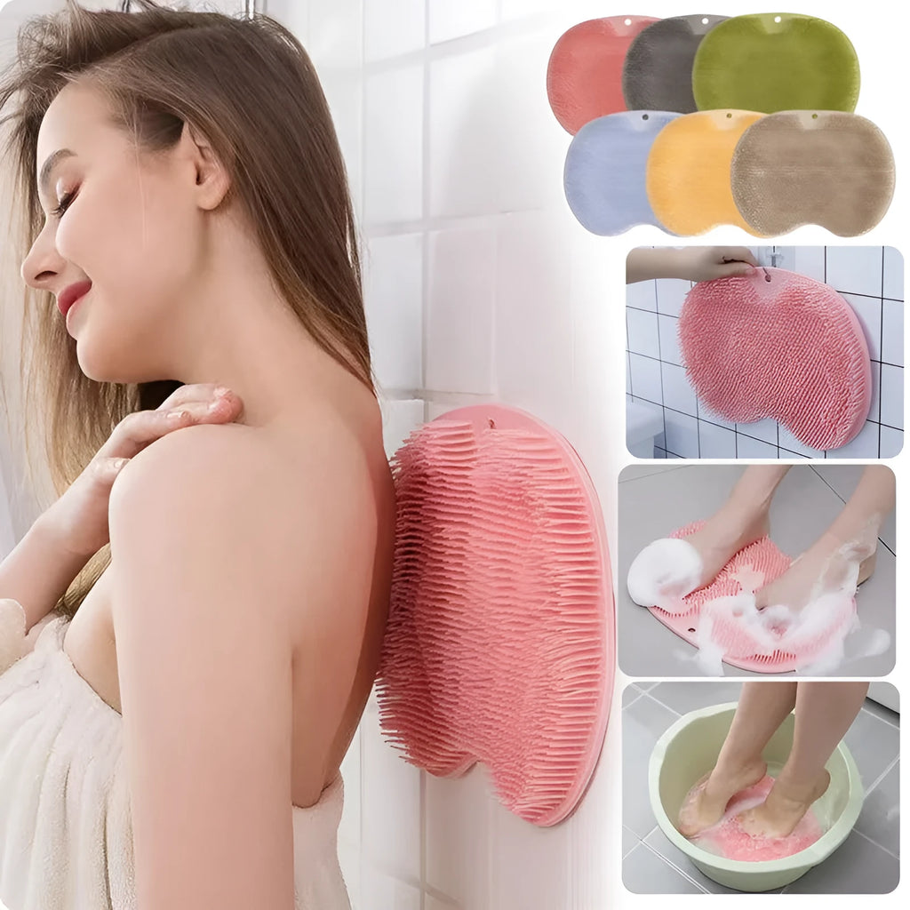 Orange silicone bristle massage bath brush with suction cup bottom on bathroom floor