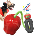 Plastic apple-shaped dog toy with squeaker in green or red for outdoor fetch and chewing