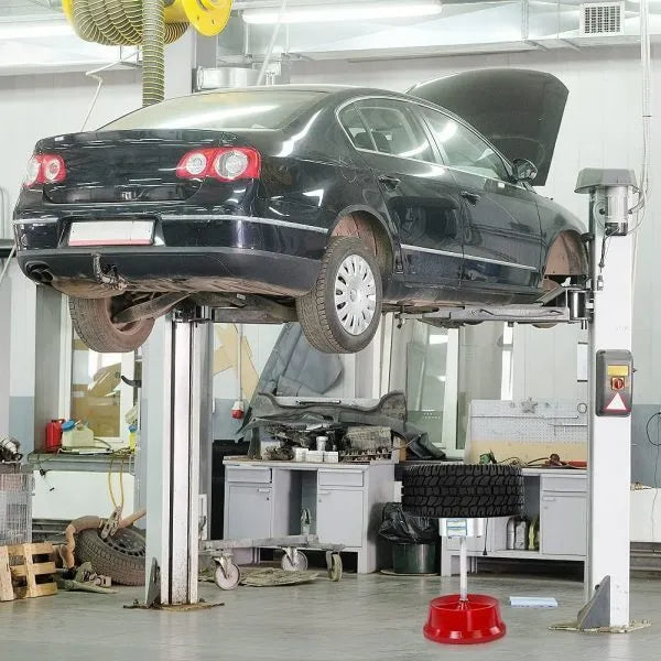 Portable aluminium hub balancer for car and truck tyres with 1.5 to 4 inch hub range on enamel-finished base.