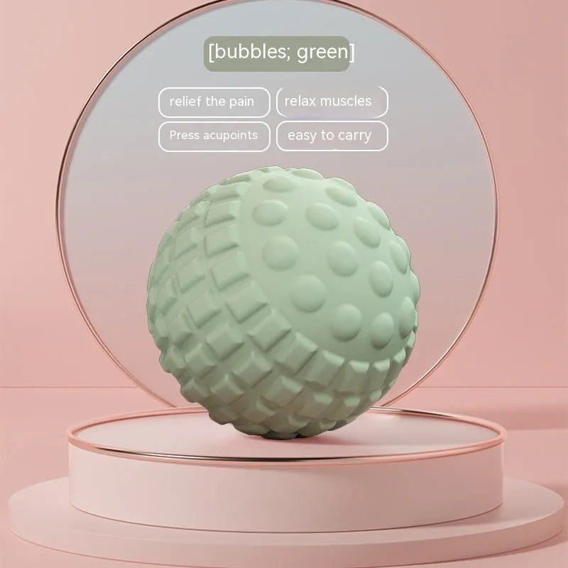 Blue TPR foot massage ball with textured surface shown next to foot for scale