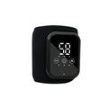 Electric heating ankle sleeve showing black and grey colour options with USB charging cable