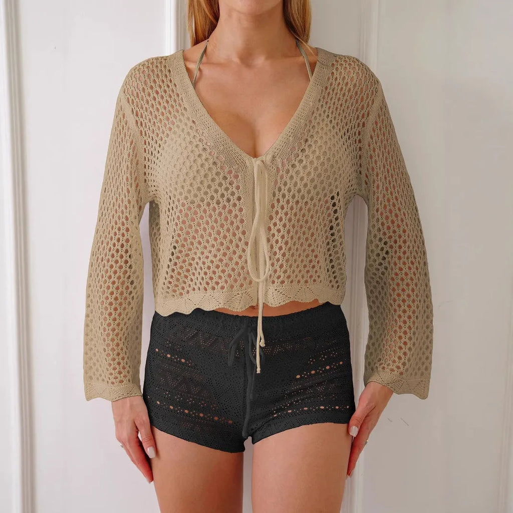 Women's apricot hollow woven cardigan blouse with short length and bell sleeves on a model