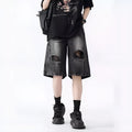 Retro loose fit denim shorts with washed and ripped detailing in blue and black colours
