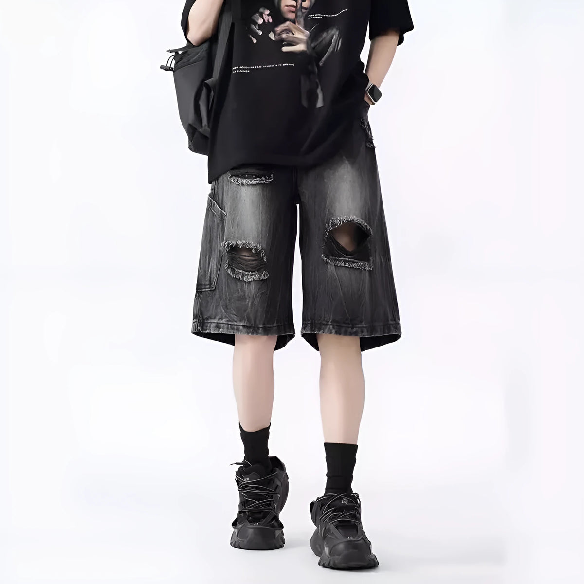 Retro loose fit denim shorts with washed and ripped detailing in blue and black colours