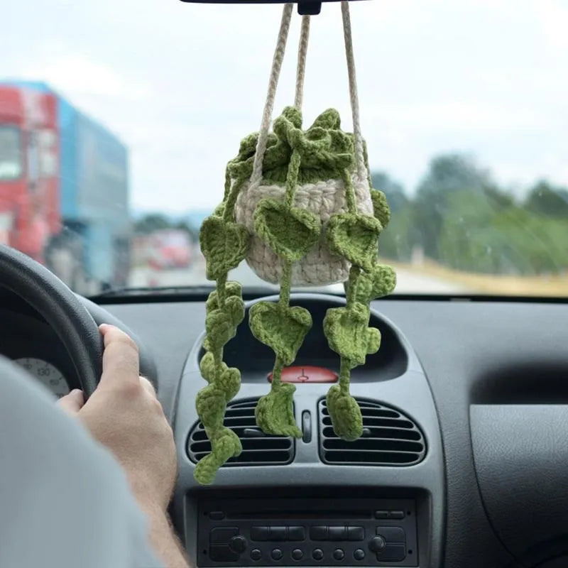 Green and white knitted wool car plant decoration with plastic base and hanging rope