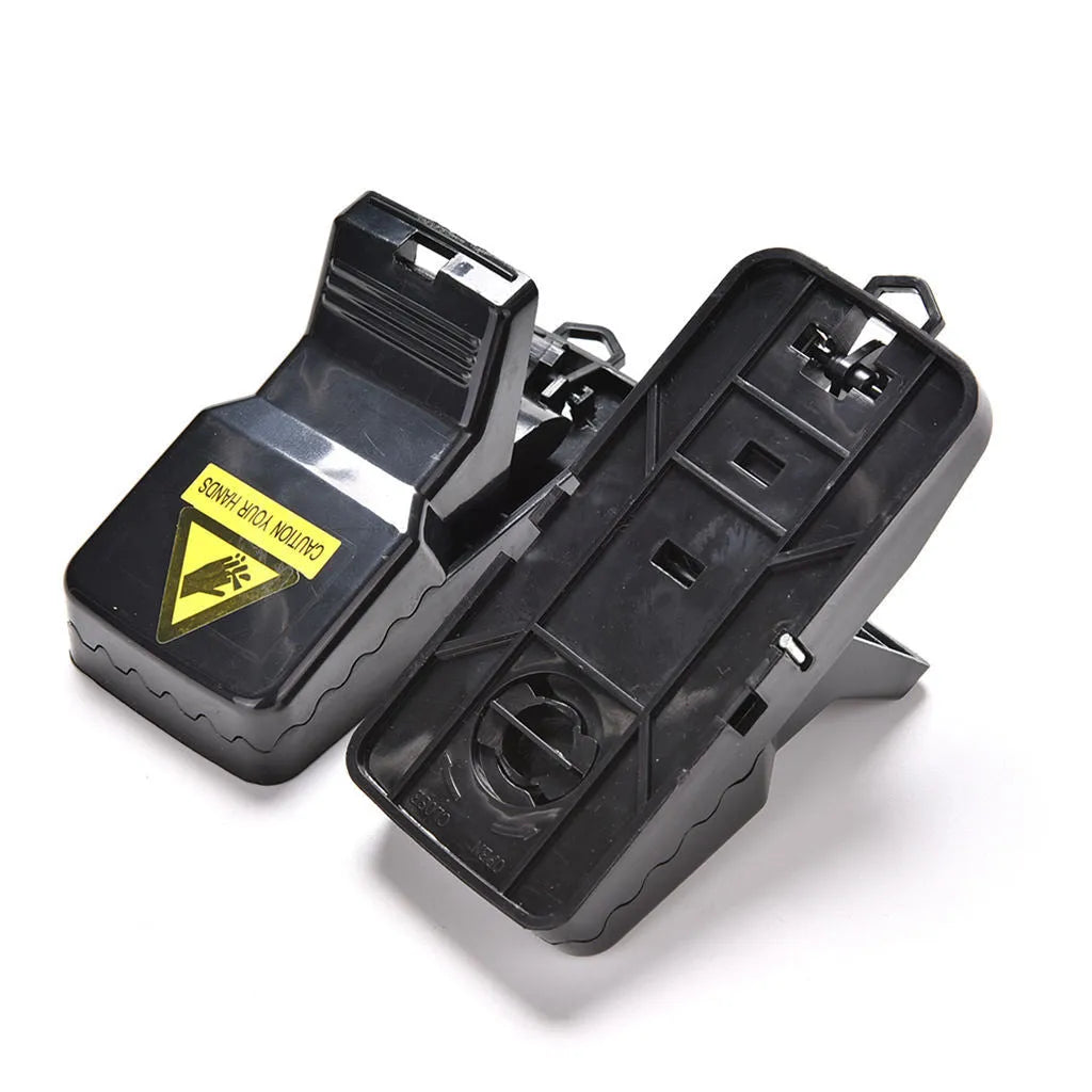 Six black snapping mousetraps showing PC+ABS alloy plastic construction and biting mechanism