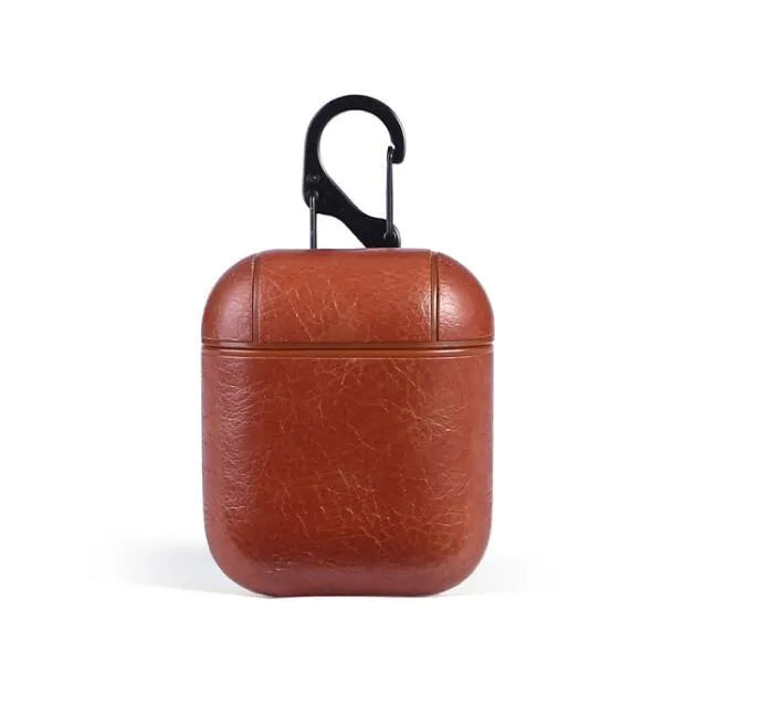 Genuine leather protective case sleeve for Apple Airpods charging case in black, brown, light brown, and red.