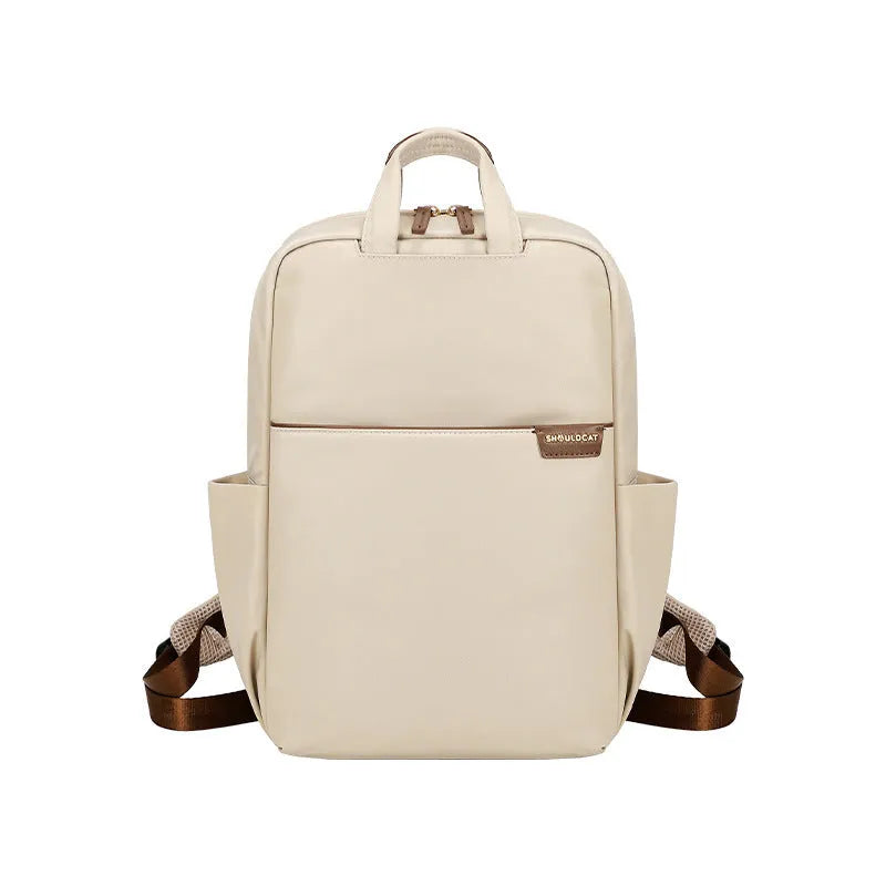 Large canvas travel backpack in apricot colour showing external pocket and urban style.
