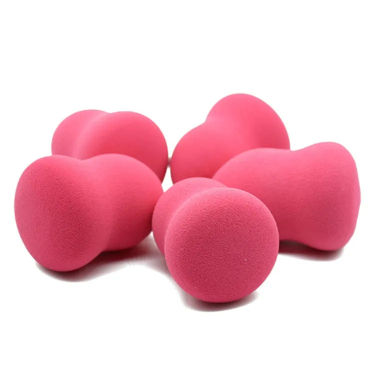 Pink hydrophilic non-latex makeup sponge for foundation, shown for scale at 4cm by 4cm by 5.6cm.